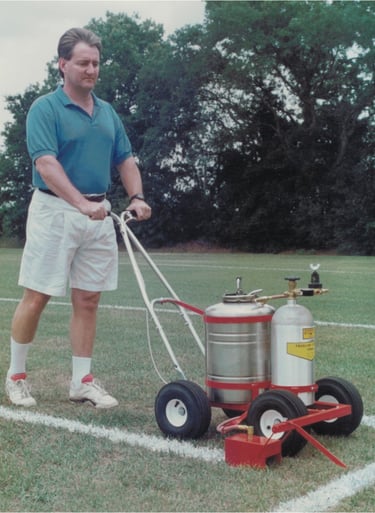 Paint a football field and soccer field using a trueline grass paint striping machine