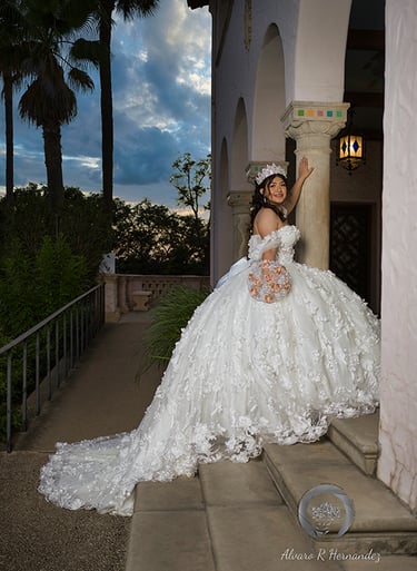 a woman in a wedding dress sitting on a staircase