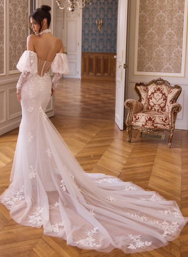 Elegant off-the-shoulder mermaid wedding dress with floral lace details and a long tulle train.