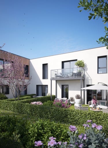 Vue des logements ouverts sur un jardin paysager dans la résidence Les Terrasses du Fort