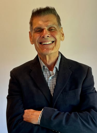 a man in a suit and tie smiling