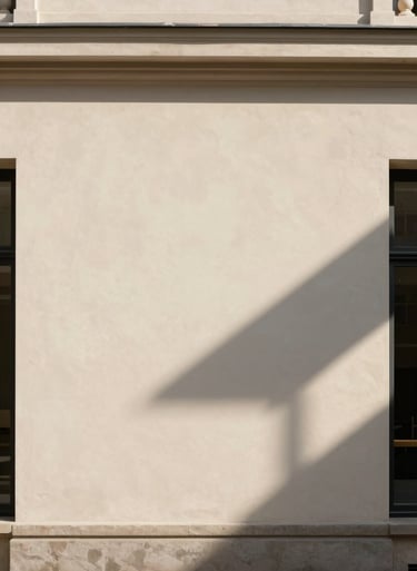 Abstract play of light and shadow on a pale beige architectural wall in a North American / European city, clean lines and timeless elegance.