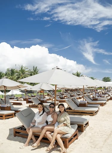 Friends enjoying a beach lifestyle portrait session at The Apurva Kempinski Bali