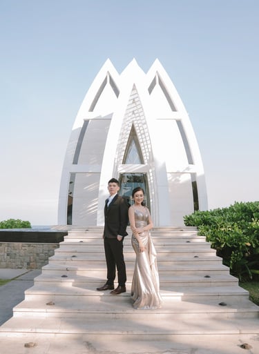 Prewedding couple on chapel stairway at The Ritz-Carlton Nusa Dua Bali.