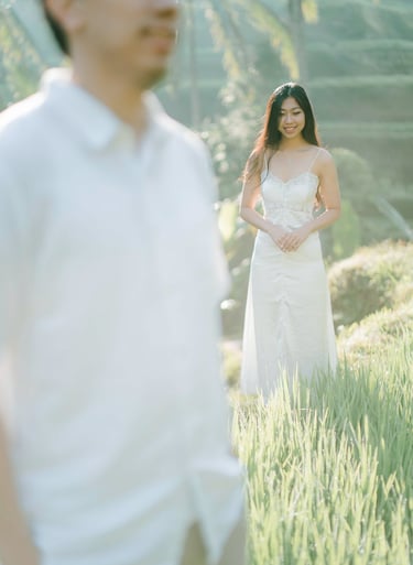 Woman standing in the rice terrace during an intimate couple photography session at Tegalalang Ubud Bali.
