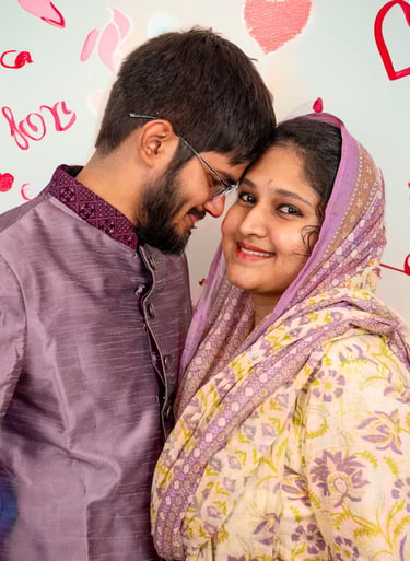 a man and woman in a purple outfit