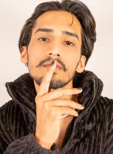 a man with a mustache and a mustache on his finger