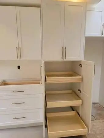 a kitchen with a pantry from kitchenrta with white cabinets and drawers