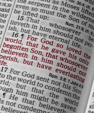 Bible open to John 3:16 in red text, emphasizing God’s love and promise of eternal life.