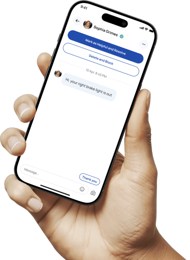 Hand holding a phone with the Blinker app shown on it