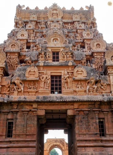 Ancient Chola stone carvings of figures at the entrance of Brihadeeswara Temple
