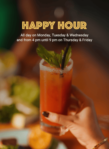 refreshing cocktail with mint garnish, featuring a blurred background of food and a Happy Hour sign