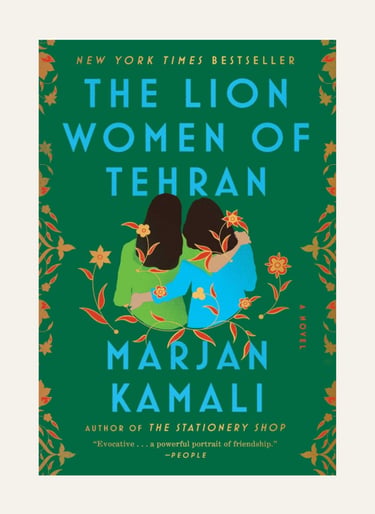 Book cover for The Lion Women of Tehran by Marjan Kamali featuring two women embracing amid floral patterns.