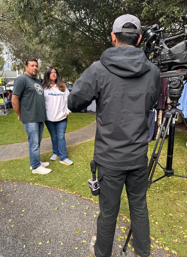 Nonprofit clients are interviewed by Television camera after media training