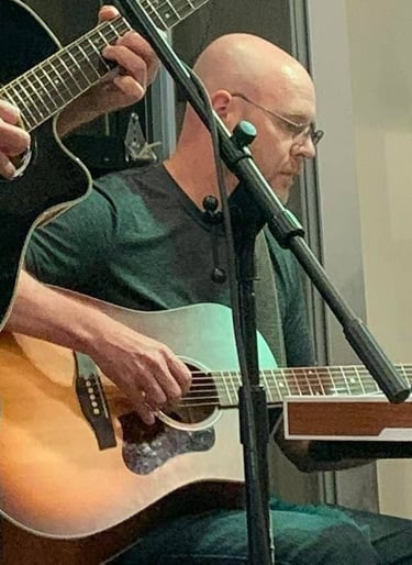 William Finn from Finn's Echo performing in front of live audience