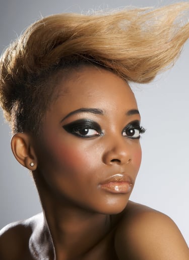Woman displaying fashion makeup and hair