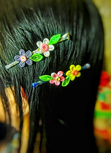 Recycle paper flower hair clips on the wear 