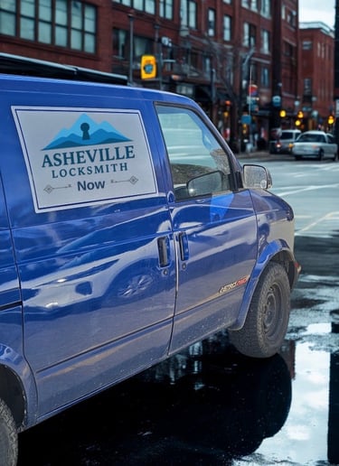 Blue work van with Asheville Locksmith logo driving through West Asheville