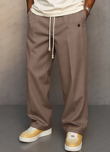 Men's brown wide-leg dress pants with drawstring waist and pleated details for a casual smart look.