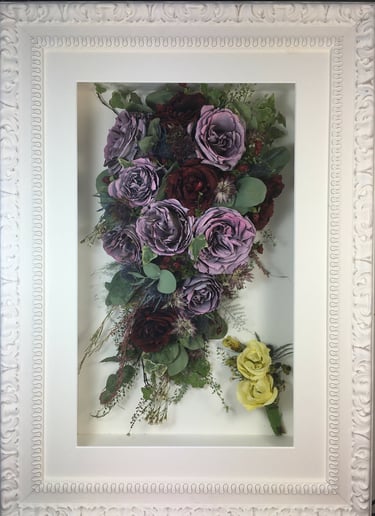 trailing view preserved wedding bouquet and buttonhole in a frame