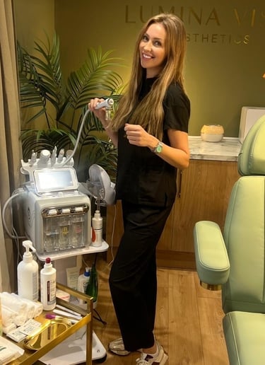 a woman in a black dress standing in a salon