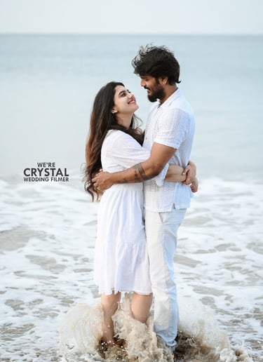 Couple hugging in white costumes Ona beach in Kerala