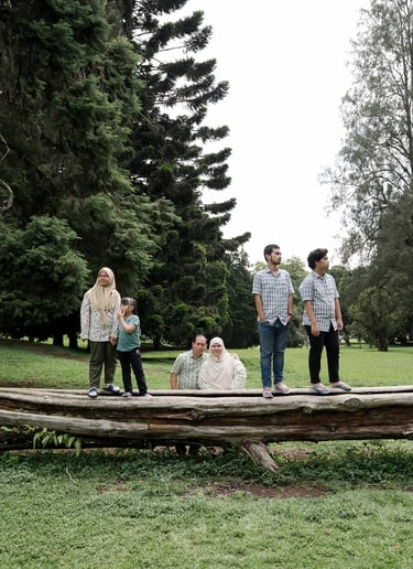 Iqbal family walking together during an outdoor family photography session at Botanical Garden Bedugul.