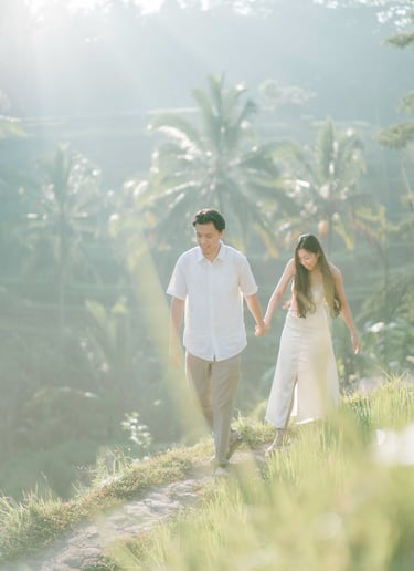 Backlit intimate couple embrace during a sunrise photography session at Tegalalang Ubud Bali.