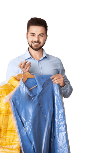 A man holding dry cleaning order on hangers