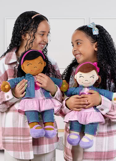 2 girls holding Aamina Desi Dolls