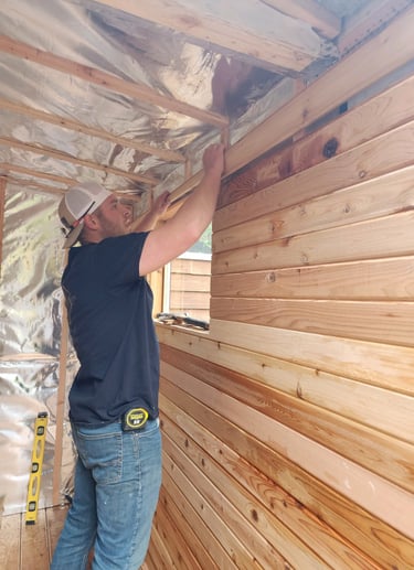 Logan working on cedar sauna