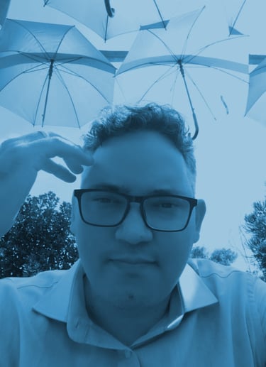 a man with glasses and a white shirt