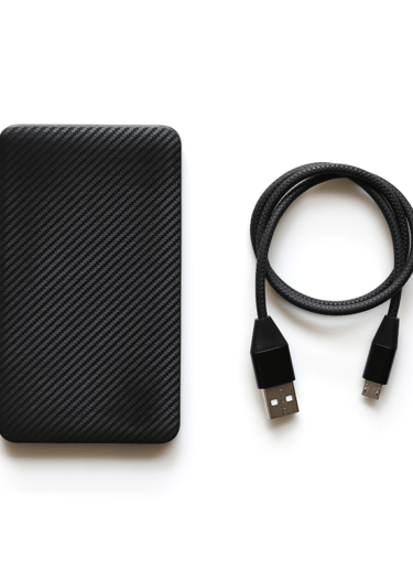 a black cell phone with a usb cable and a usb cable