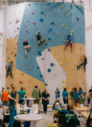 a group of people lead climbing