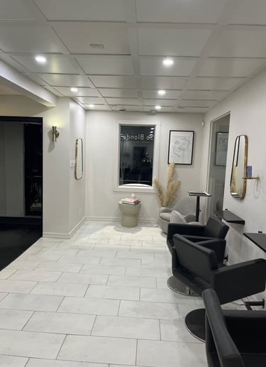 a bathroom with a toilet and a tub in the middle of the room