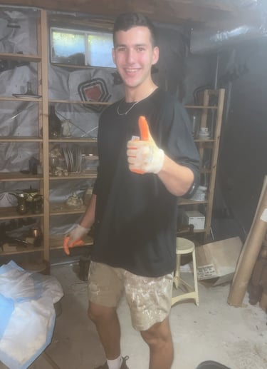 Junk removal crew wearing protective gear during cleanout work