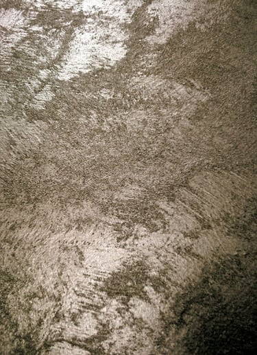 A warm silver paint sample showing its lustre and beautiful grainy texture.