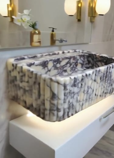 A bathroom sink with a marble sink