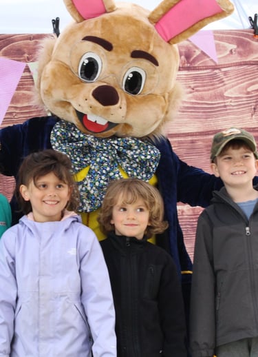Easter Bunny poses with kids during a meet and greet
