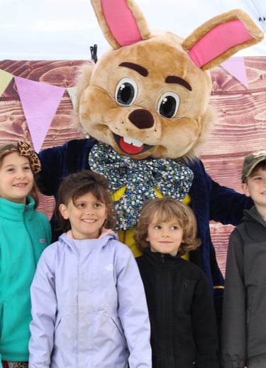 Easter Bunny poses with kids during a meet and greet