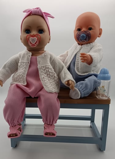 Baby Annabell and Baby Born dressed in pink and blue