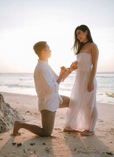 Beach proposal moment during a couple photography session at Anantara Uluwatu Bali Resort.