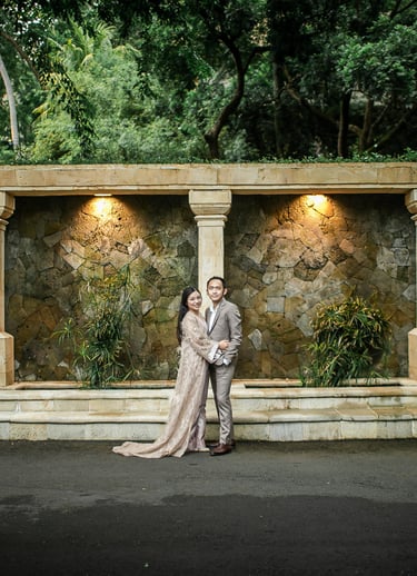 Prewedding portrait under stone arch courtyard at Amankila Karangasem Bali