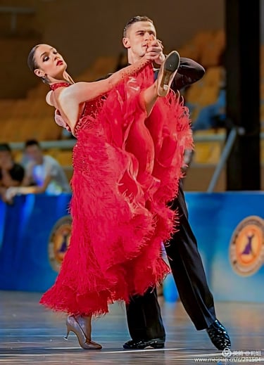 a ballroom couple staying at pose where a women  holding her leg up 