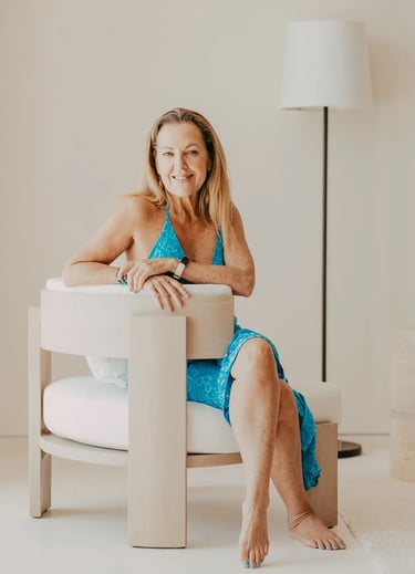 online yoga instructor seated in blue dress erin burden