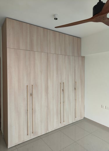 alt="Custom BWP plywood wardrobes in master bedroom by Integrity Enterprise"
