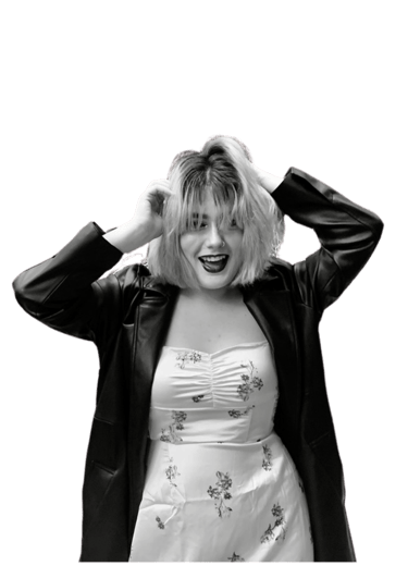 a woman in a white dress and black jacket