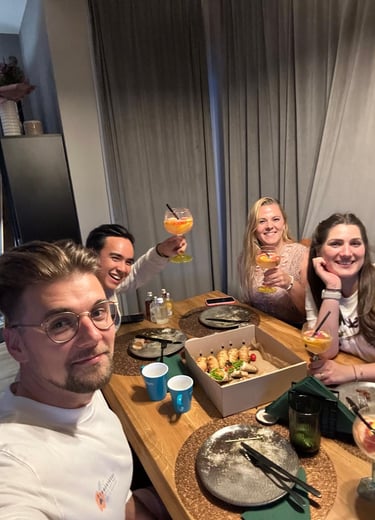 Friends toasting and enjoying homemade food during warm evening in Łódź