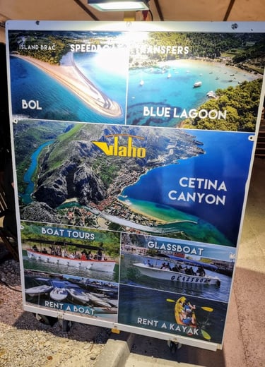 The picture shows a billboard advertising a one-day boat visit to Bol and the Cetina river canyon.