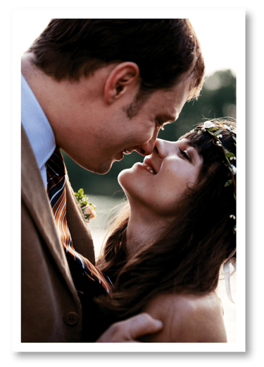 Close up of a newlyweds kissing.